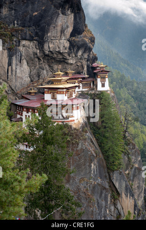 Tibetan Buddhism, Taktsang Palphug Monastery on a rock face, also known as The Tiger's Nest, near Paro, Himalayas, Bhutan Stock Photo