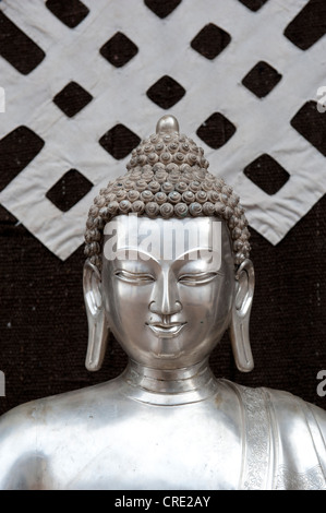 Tibetan Buddhism, silver Buddha statue, symbol of the endless knot or eternal knot, Jokhang Temple, Lhasa, Himalayas, Tibet Stock Photo