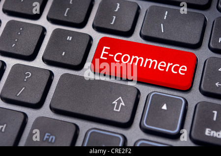 concept of e-commerce or ecommerce, electronic commerce, with message on computer keyboard. Stock Photo