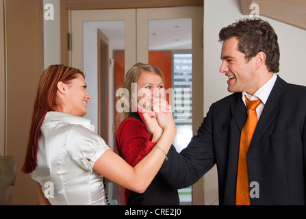 three young successful business people cheering Stock Photo