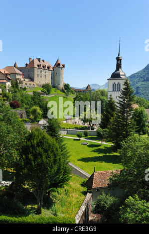 Old city walls around the medieval town, in the back Château de Gruyères castle, Gruyères, Fribourg, Switzerland, Europe Stock Photo