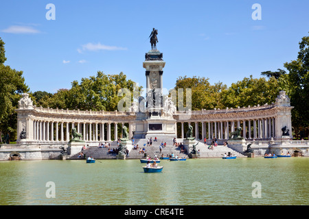 Excursion boats on the lake in front of the monument to Alfonso XII., in the Parque del Buen Retiro in Madrid, Spain, Europe Stock Photo