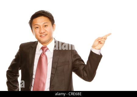 Man in business attire pointing and presenting (isolated on white) Stock Photo