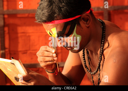 Kathakali dancer man closeup prepares to dance in Kerala, India Stock Photo