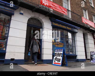 Beatles fan walking into the Beatles store on Baker Street in London, England, May 15, 2012, © Katharine Andriotis Stock Photo