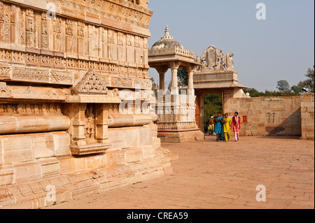 Women wearing colorful saris and walking round a courtyard in a Hindu temple in Chittorgarh, Rajasthan, India, Asia Stock Photo