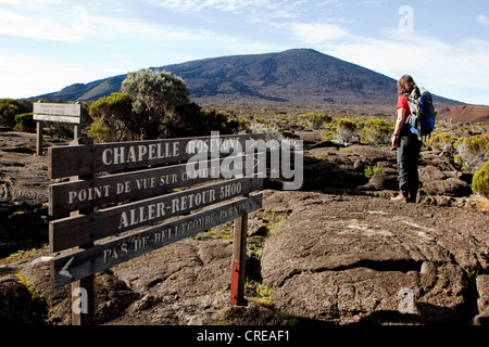 Hiker on the path to the Piton de la Fournaise volcano, La Reunion island, Indian Ocean Stock Photo