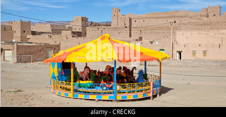 Merry-go-round on the village square in Tinezouline, Draa valley, Morocco, Africa Stock Photo