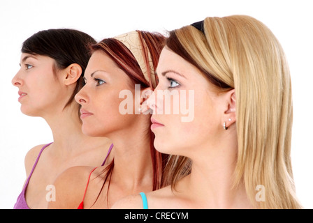 three young, attractive women in side-face Stock Photo