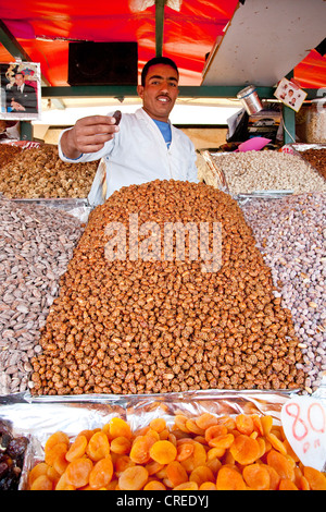 Dried fruits, nuts, dates and almonds at a market stall, on the Djemaa el Fna market place in the Medina, historic district Stock Photo