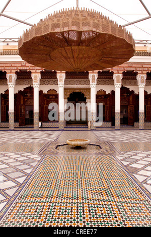 Fountain in the inner courtyard of the Ben Youssef Madrasa, an Islamic college, Medina, historic district Stock Photo