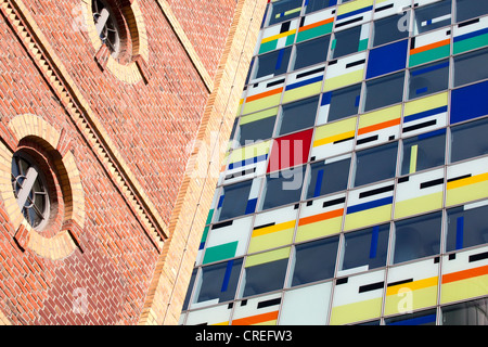 Alte Maelzerei brick building and the modern Colorium tower, Medienhafen port in Duesseldorf, North Rhine-Westphalia Stock Photo