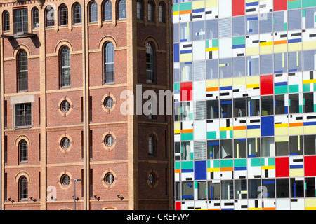 Alte Maelzerei brick building and the modern Colorium tower, Medienhafen port in Duesseldorf, North Rhine-Westphalia Stock Photo