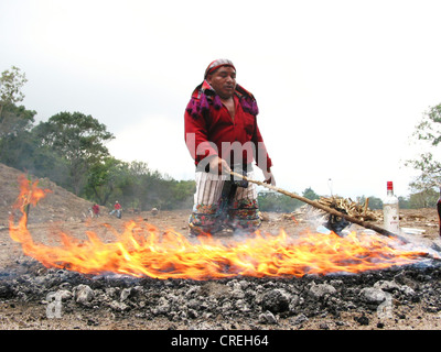 Mayan priests in ritual with Maya altar, burning candles and ...