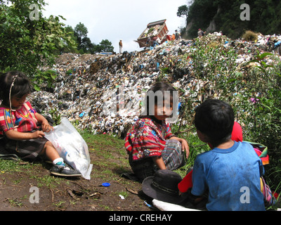 Playing Mayan children in waste deposit, Guatemala, Quich� Stock Photo