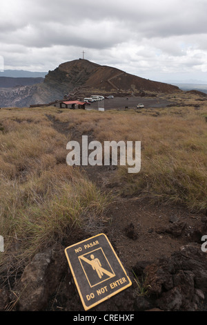 Sign, lettering 'No pasar - Do not enter', vegetation and lava fields on the Masaya Volcano, which is still active Stock Photo