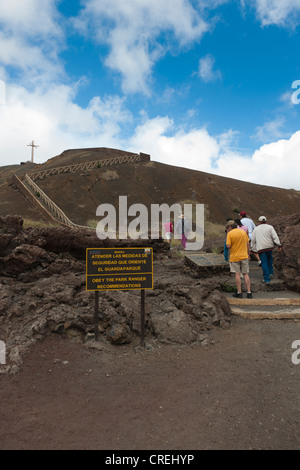 Tourists standing at the bottom of the Masaya Volcano, which is still active, Masaya Volcano National Park, Nicaragua Stock Photo