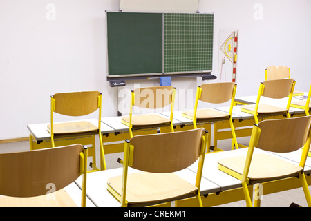 Chairs on desks in a classroom in a school in Straubing, Bavaria, Germany, Europe Stock Photo