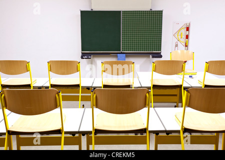 Chairs on desks in a classroom in a school in Straubing, Bavaria, Germany, Europe Stock Photo