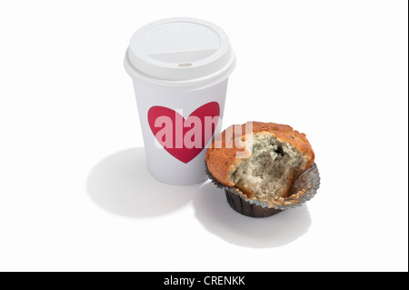A half eaten blueberry muffin and a takeaway drink cup Stock Photo