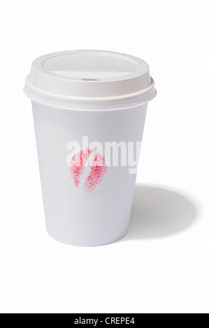 A takeaway drink cup with a lipstick kiss print on the side Stock Photo