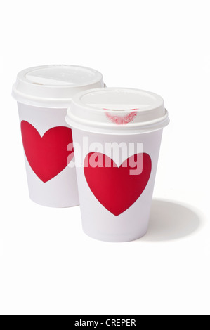 Two takeaway drink cups with love hearts, one with a lipstick mark Stock Photo