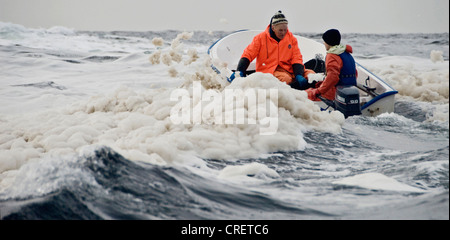 Young boy and old man fishing together in south-western Norway, Norway, Hidra, Vest-Agder, Flekkefjord Stock Photo