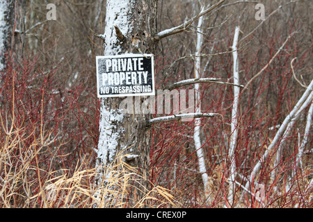 Private Property No Trespassing sign in a rural area. Stock Photo