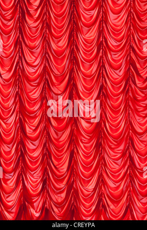 Brightly red lit curtains for your background Stock Photo