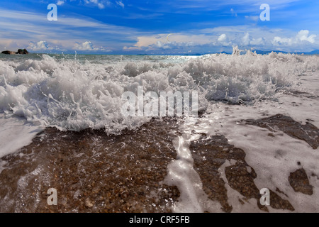 Big wave front with bubbles and splashes closeup view Stock Photo