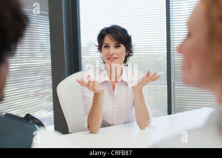 Businesswoman talking in office Stock Photo