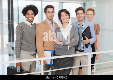 Business people smiling in office Stock Photo