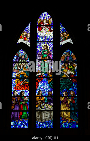 Stained glass window reliegious scene in the Almudena Cathedral in Madrid, Spain. Stock Photo