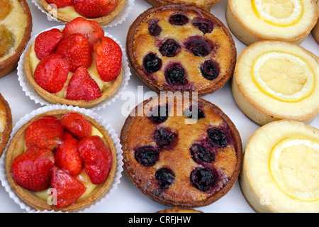 Delicious tarts,cakes and pastries for sale and on temporary display during the Marylebone Fayre in London 2012 Stock Photo