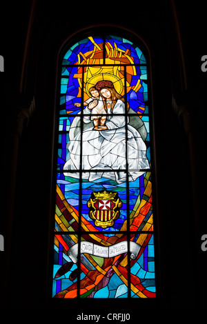 Stained glass window reliegious scene in the Almudena Cathedral in Madrid, Spain. Stock Photo