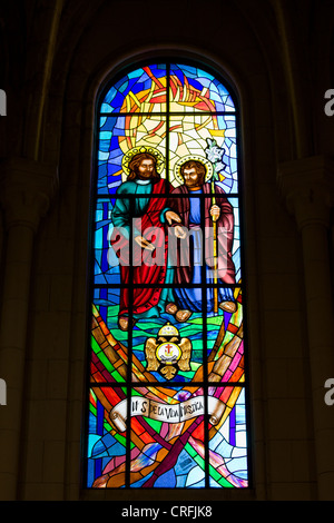 Stained glass window religious scene in the Almudena Cathedral in Madrid, Spain. Stock Photo