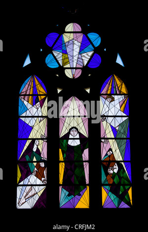 Modern stained glass window religious scene in the Almudena Cathedral in Madrid, Spain. Stock Photo