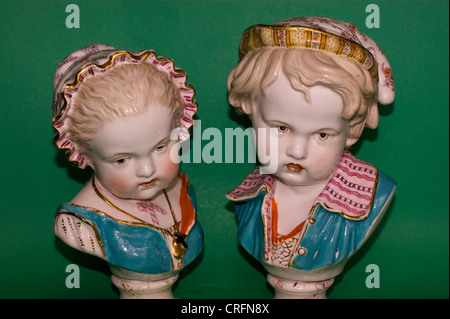 PAIR OF ANTIQUE BRITISH  PORCELAIN BUSTS OF CHILDREN BY BEVINGTON Stock Photo