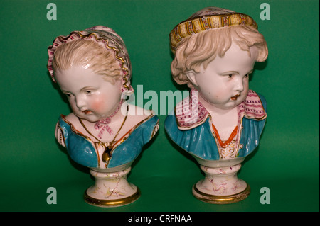 PAIR OF ANTIQUE BRITISH  PORCELAIN BUSTS OF CHILDREN BY BEVINGTON Stock Photo
