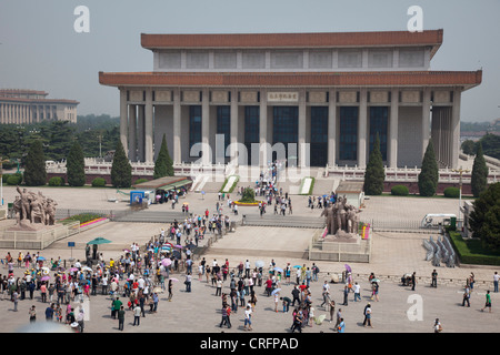 Crowds of Chinese tourists gather outside the Chairman Mao Memorial Hall in Tiananmen Square, Beijing, China. Stock Photo