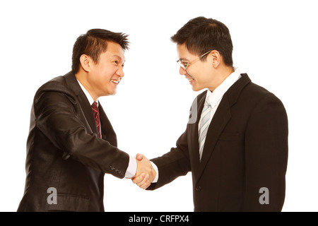 Two men in business attire shaking hands (isolated on white) Stock Photo