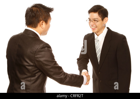 Two men in business attire shaking hands (isolated on white) Stock Photo