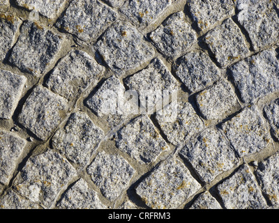 A road paved with setts in a village in Italy. Stock Photo
