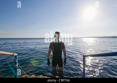 Snorkeler standing in open water Stock Photo
