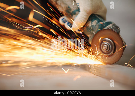 metal sawing close up sparks spray Stock Photo