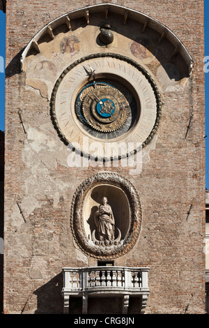 Ornate clock and statue on tower Stock Photo