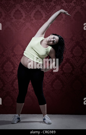 Woman stretching at home Stock Photo
