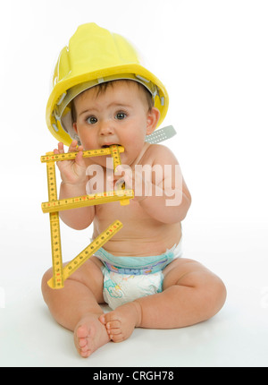 little child with diaper as building worker Stock Photo