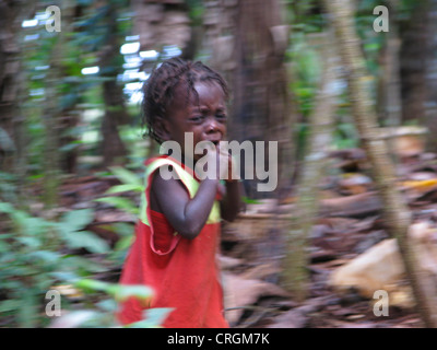 little boy in rural area, scared, crying and running away from photographer, Haiti, Grande Anse, Jeremie Stock Photo