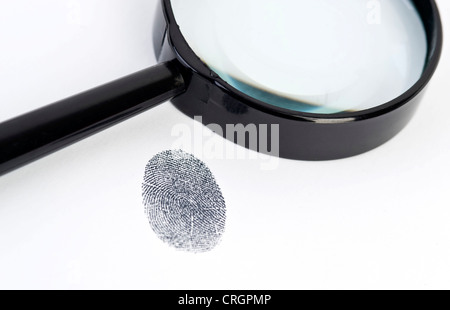 fingerprint under loupe Stock Photo